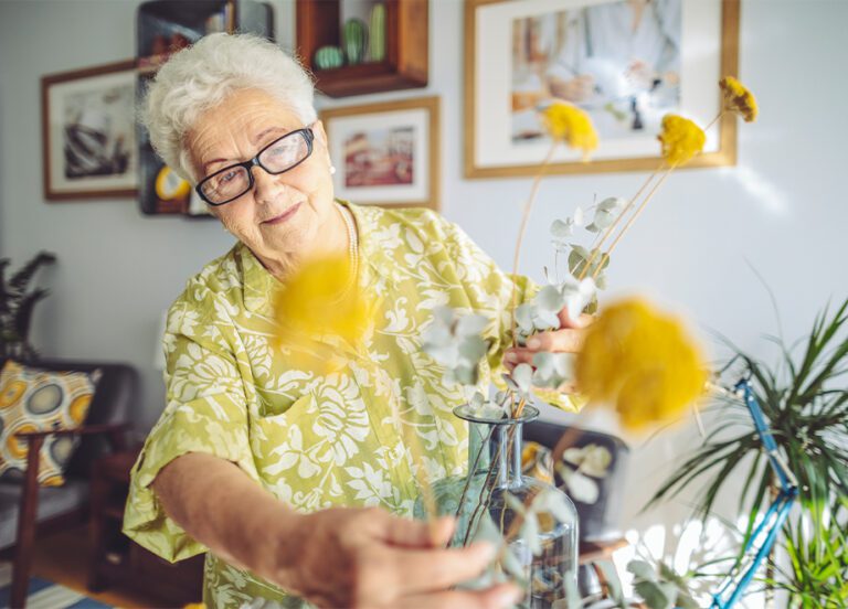The Heritage of Green Hills | Senior woman putting together bouquet