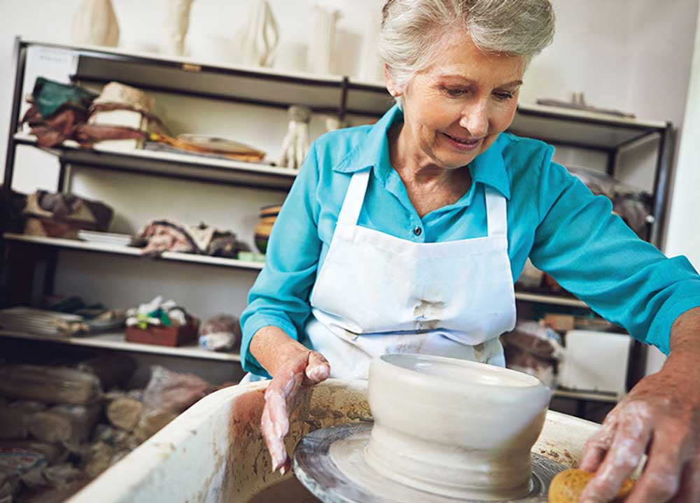 The Heritage of Green Hills | Senior woman making pottery