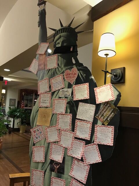 The Heritage of Green Hills | Cardboard cut out of the Statue of Liberty covered in sticky notes